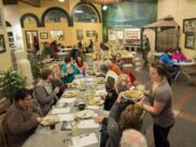 Woody&#039;s Tacos waitress Stephanie Sheldon, right, serves food and margaritas during the First Presbyterian Church theopub on Feb. 4.