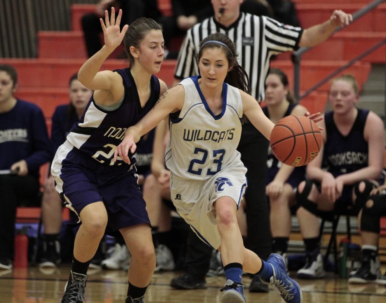 La Center's Andrea Griffee (23) drives on Nooksack Valley's Jenna Tenkley during Saturday's 1A state regional playoff game at Battle Ground High School.