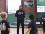 Kearse tosses around football with older kids.