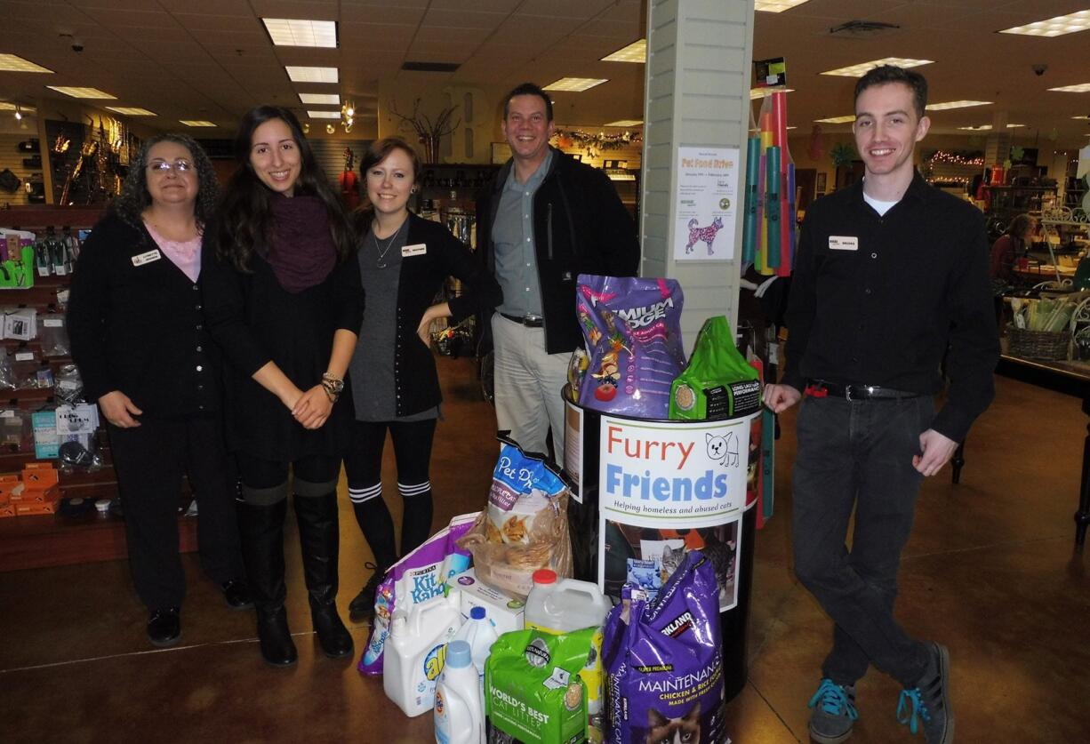 Left, Lynette Jensen, education center director, along with other Beacock Music employees who participated in the drive.