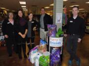 Left, Lynette Jensen, education center director, along with other Beacock Music employees who participated in the drive.