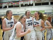 Members of the Skyview girls basketball team celebrate their win over Bellarmine on Friday night, Feb. 26, 2016 at Battle Ground High School.