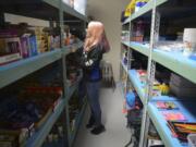 Sophia Reyes, a senior at La Center High School, organizes food in the school&#039;s food pantry on Feb. 16. With a growing population of students who are going hungry, the local nonprofit, Lewis River Mobile Food Bank, worked with the school to start the food pantry.