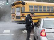 Deputy Sheriff Todd Young issues a citation to a woman who was speeding in a school zone near Covington Middle School on Monday.  The woman had just come from dropping off her child at school and told Young she was late for work.