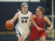 Skyview&#039;s Kirsten Johnson (24) takes on Camas defender Meghan Finley (2) in the second quarter Tuesday night, Feb. 2, 2016 at Skyview High School gym.