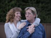 Leanne Hall, left, and her wife, Lana Hall, of Vancouver have been together 24 years. Two years ago, Lana nearly died after an aneurysm ruptured while she was working in the yard.