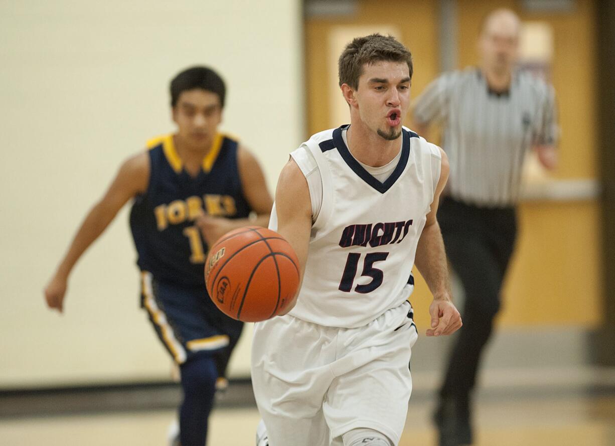 King's Way's Kyle Gonzales, center, leads a fast break in the second quarter Friday night, Feb. 12, 2016 at King's Way gym.