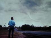 Actor Bill Paxton surveys a tornado in a still taken from the 1996 natural disaster thriller &quot;Twister.&quot; (Ron Batzdorff/Universal Studios and Warner Bros.