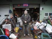 Dean Yankee stands amid his inventory at Yankee&#039;s Custom Farming outside of Battle Ground in December. The 59-year-old says he has &quot;moved a mile and a half my whole life here&quot; and turned the family farming services business into a garage sale for those who don&#039;t want to hold their own.