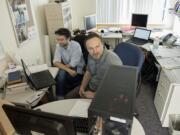 Jean Liénard, left, and Nikolay Strigul run a computer simulation to grow a digital forest Thursday in Strigul&#039;s office on the Washington State University Vancouver campus.