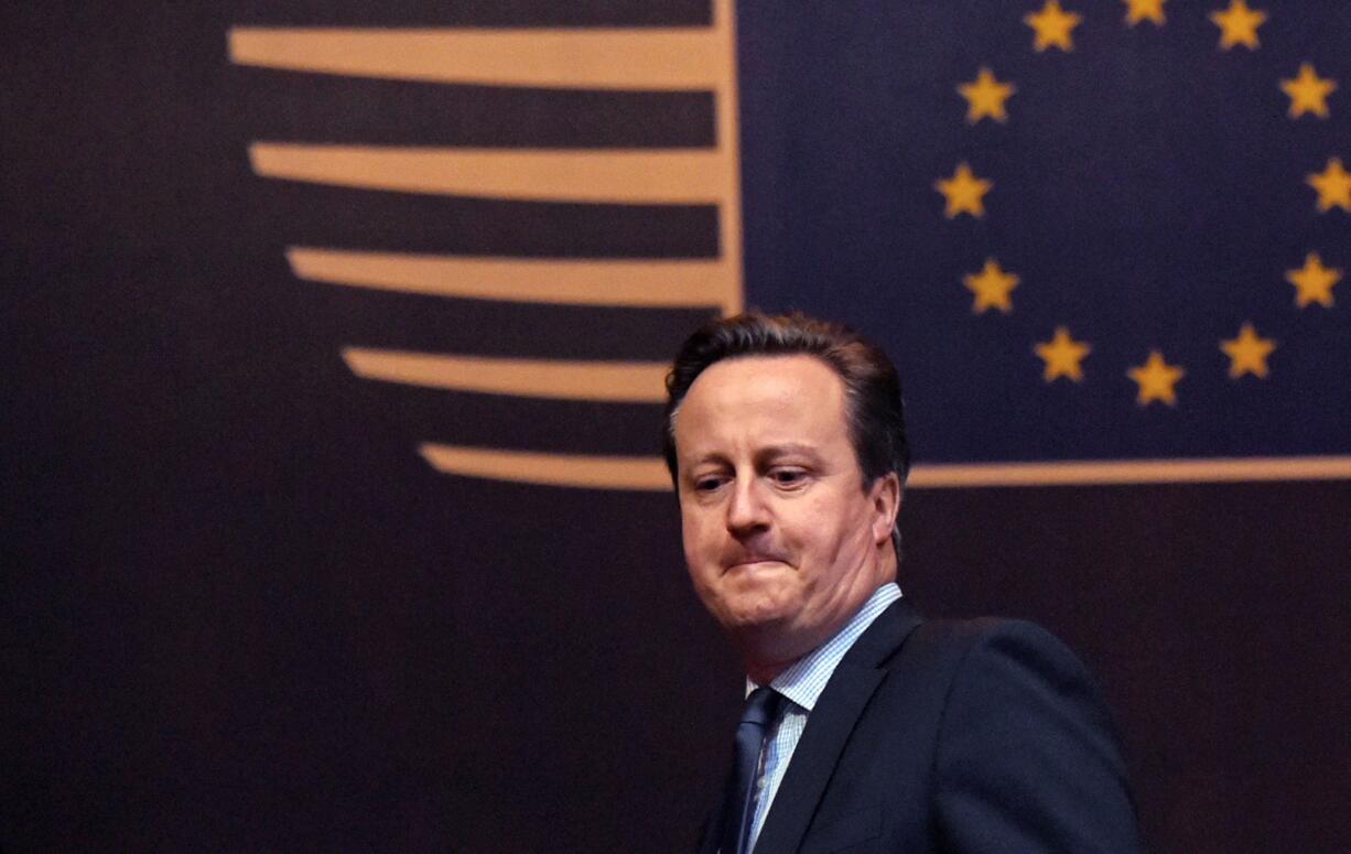 British Prime Minister David Cameron leaves the EU Council building after an EU summit Friday in Brussels.