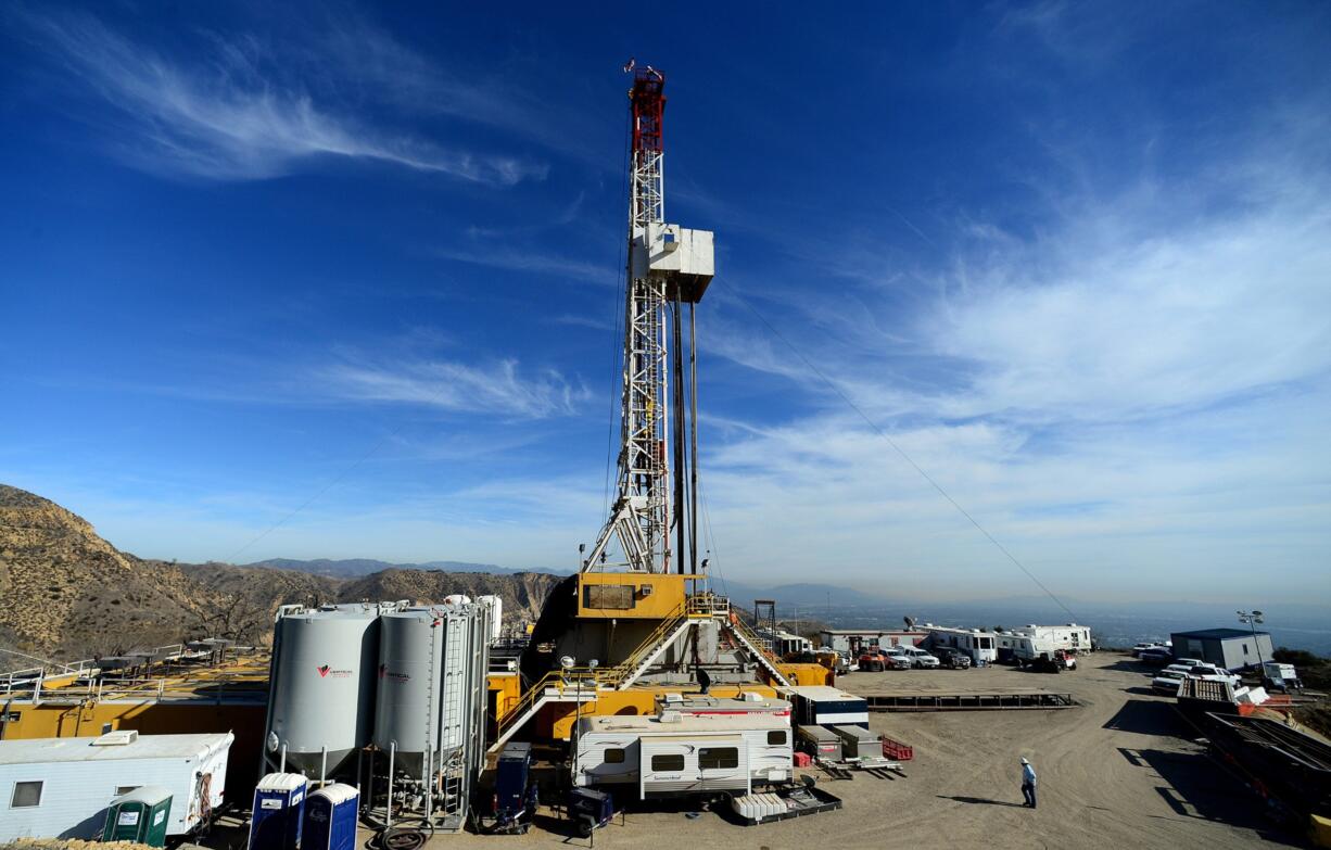 FILE - In this Dec. 9, 2015, pool file photo, crews work on a relief well at the Aliso Canyon facility above the Porter Ranch area of Los Angeles. A California official outlined a plan Thursday, Feb. 4, 2016, to cap the massive Los Angeles-area gas leak by the end of next week. The announcement at a public meeting is ahead of the company&#039;s worst-case prediction that it would be plugged by the end of the month. The well has been leaking for 15 weeks.