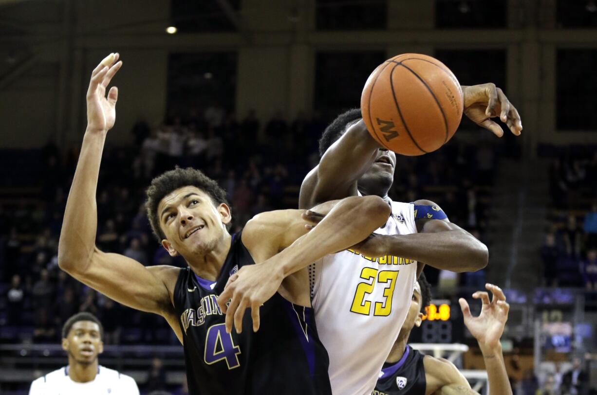 Washington's Matisse Thybulle (4) and California's Jabari Bird (23) struggle for the ball during the second half of an NCAA college basketball game Thursday, Feb. 18, 2016, in Seattle. Bird was called for a foul on the play with 3.3 seconds left in the game. California won 78-75.