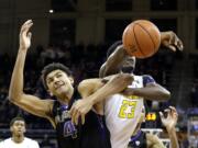 Washington's Matisse Thybulle (4) and California's Jabari Bird (23) struggle for the ball during the second half of an NCAA college basketball game Thursday, Feb. 18, 2016, in Seattle. Bird was called for a foul on the play with 3.3 seconds left in the game. California won 78-75.