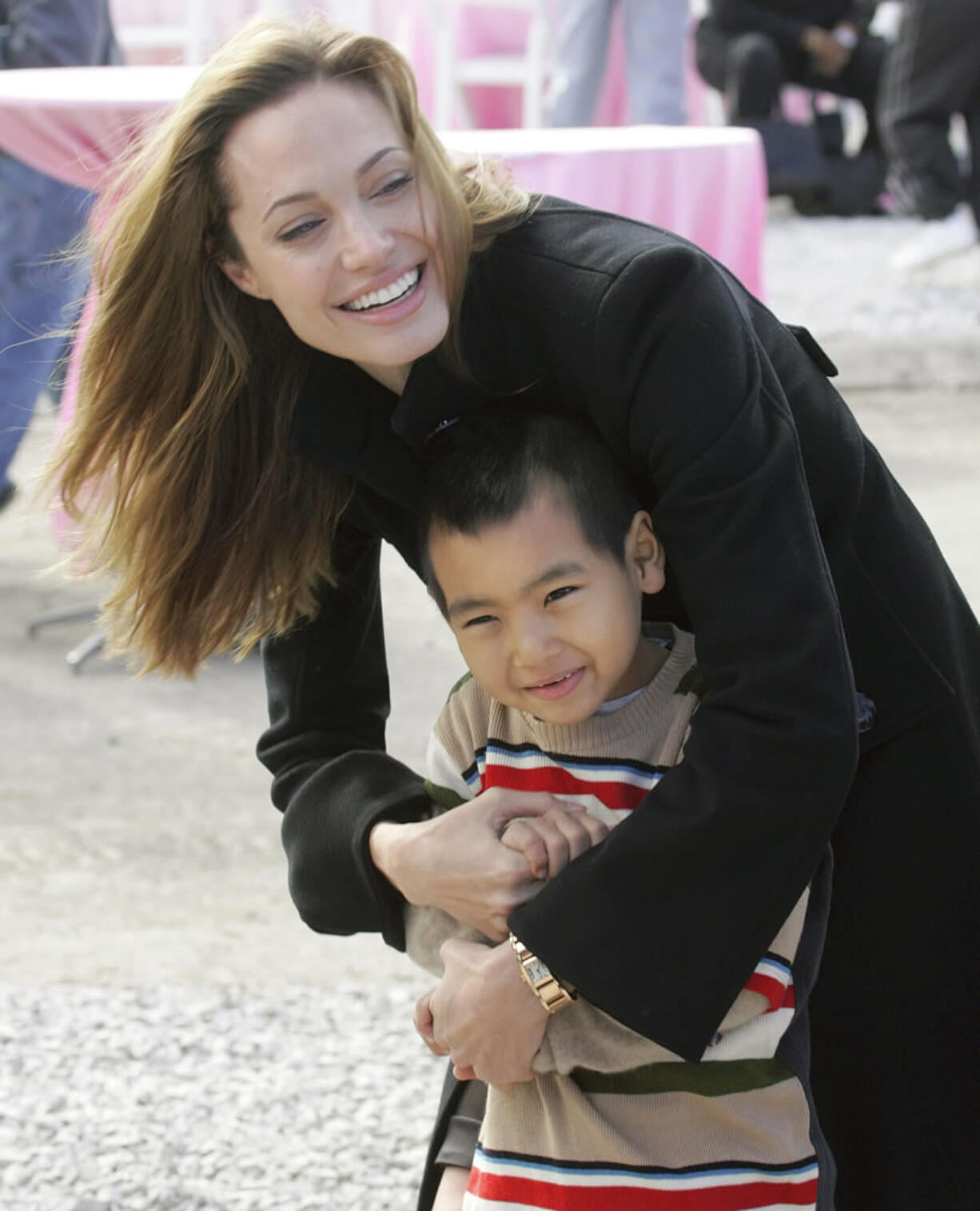 Actress Angelina Jolie plays with her son, Maddox, who she adopted from Cambodia, in New Orleans&#039; Lower 9th Ward in December 2007. Angelina Jolie Pitt adopted Maddox in 2002, and a year later opened a foundation in his name in Cambodia&#039;s northwestern Battambang province. The foundation helps fund health care, education and conservation projects in rural Cambodia.