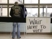 A South Carolina voter cast his ballot to vote in the Republican presidential primary Saturday, Feb. 20, 2016, in Lexington, S.C.