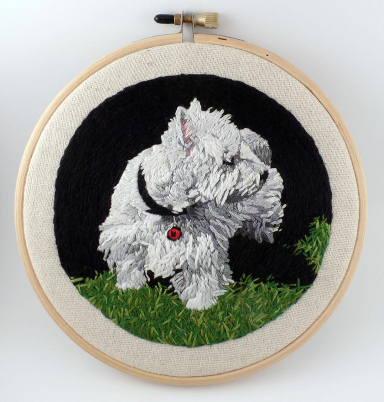 This photo provided by Kathy Halper Art &amp; Embroidery shows an embroidered dog portrait, &quot;Seamus,&quot; by longtime painter Halper, of Highland Park, Ill. ?Embroidery has always been considered a craft, (but) I approach it as an equal, contemporary art form,? says Halper. &quot;The excitement for me is creating the painting experience with thread.?