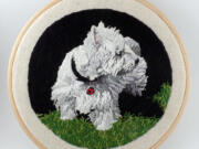 This photo provided by Kathy Halper Art &amp; Embroidery shows an embroidered dog portrait, &quot;Seamus,&quot; by longtime painter Halper, of Highland Park, Ill. ?Embroidery has always been considered a craft, (but) I approach it as an equal, contemporary art form,? says Halper. &quot;The excitement for me is creating the painting experience with thread.?