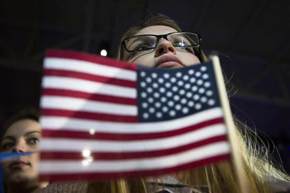 An audience member listens as a presidential candidate  speaks during a campaign stop Monday in Durham, N.H.