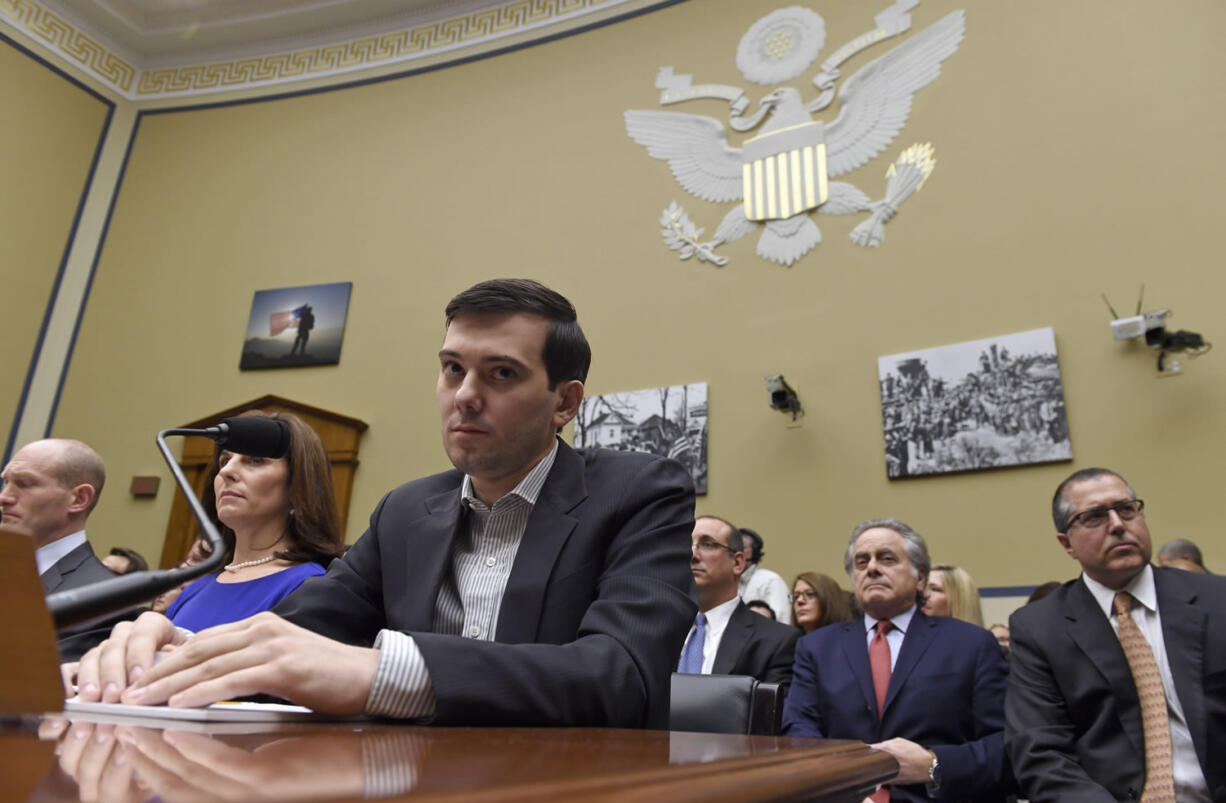 In this file photo, pharmaceutical chief  Martin Shkreli waits on Capitol Hill in Washington, Thursday, Feb. 4, 2016, for the start of the House Committee on Oversight and Reform Committee hearing on his former company's decision to raise the price of a lifesaving medicine.