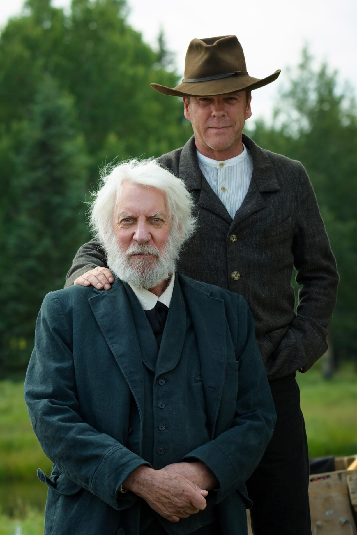 This photo provided by Momentum Pictures shows, Donald Sutherland, left, as Reverend William Clayton and Kiefer Sutherland as John Henry Clayton in the western ?Forsaken,? a Momentum Pictures release.