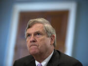 FILE - In this Oct. 7, 2015 file photo, Agriculture Secretary Tom Vilsack, pauses as he testifies on Capitol Hill in Washington before the House Agriculture Committee hearing on the 2015 Dietary Guidelines for Americans.  Retailers that accept food stamps would have to start stocking a wider variety of healthy foods or face the loss of consumers under proposed rules expected to be announced by the Agriculture Department on Tuesday.