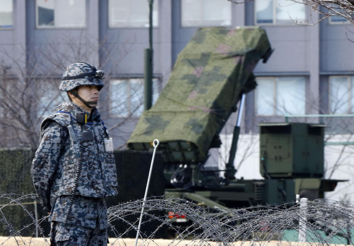 A Japan Self-Defense Force member stands by a PAC-3 Patriot missile unit deployed for North Korea&#039;s rocket launch at the Defense Ministry in Tokyo, on Sunday. Japan&#039;s Defense Ministry installed missile interceptors at their headquarters in central Tokyo on Friday amid signs that North Korea may be preparing to launch a rocket or missile.