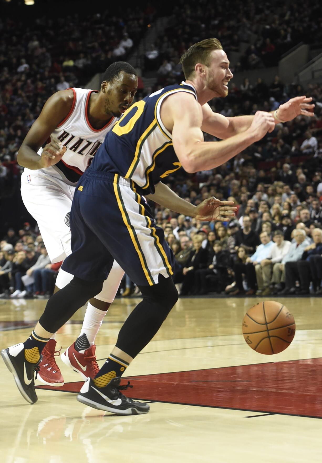 Portland Trail Blazers forward Al-Farouq Aminu (8) knocks the ball away from Utah Jazz forward Gordon Hayward (20) during the first half of an NBA basketball game in Portland, Ore., Sunday, Feb. 21, 2016.