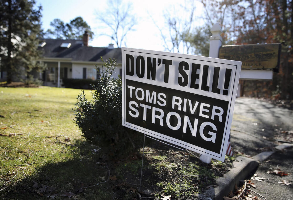 A sign saying, &quot;Don&#039;t Sell! Toms River Strong,&quot; is seen on a street Monday in Toms River, N.J.