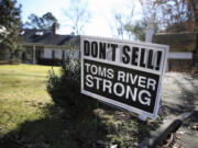 A sign saying, &quot;Don&#039;t Sell! Toms River Strong,&quot; is seen on a street Monday in Toms River, N.J.