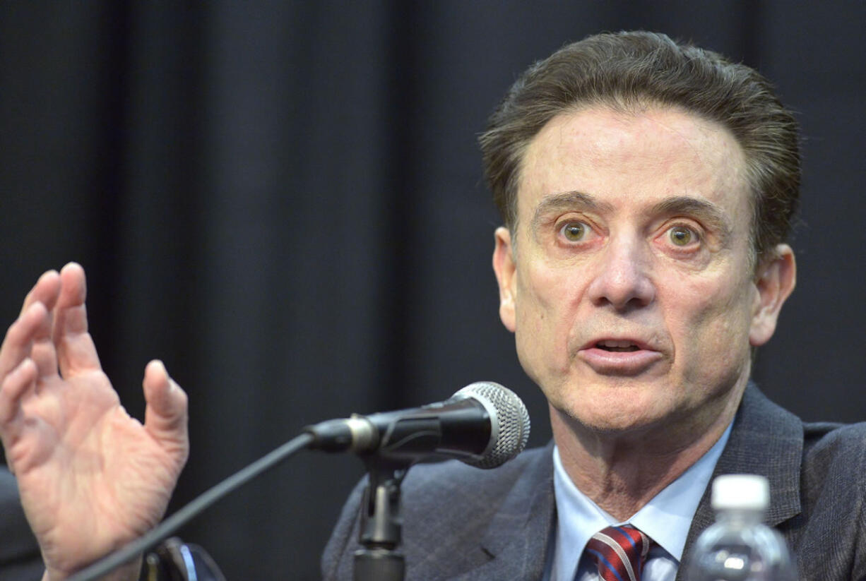 Louisville head basketball coach Rick Pitino speaks to the media following the University's announcement that they will be self-imposing a ban on postseason play for the 2015-16 season, Friday, Feb. 5, 2016, in Louisville Ky. Louisville announced a one-year postseason ban for its men's basketball team amid ongoing investigations into a sex scandal in which an escort alleged that a former staffer paid her and other dancers to strip and have sex with recruits and players. (AP Photo/Timothy D.