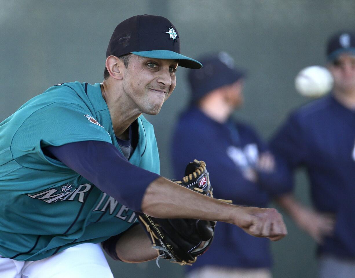 Seattle Mariners pitcher Steve Cishek throws during spring training baseball practice Saturday, Feb. 20, 2016, in Peoria, Ariz.