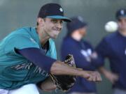 Seattle Mariners pitcher Steve Cishek throws during spring training baseball practice Saturday, Feb. 20, 2016, in Peoria, Ariz.