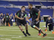 Michigan State offensive lineman Jack Conklin, left, blocks Western Michigan offensive lineman Willie Beavers during a drill at the NFL football scouting combine in Indianapolis, Friday, Feb. 26, 2016.