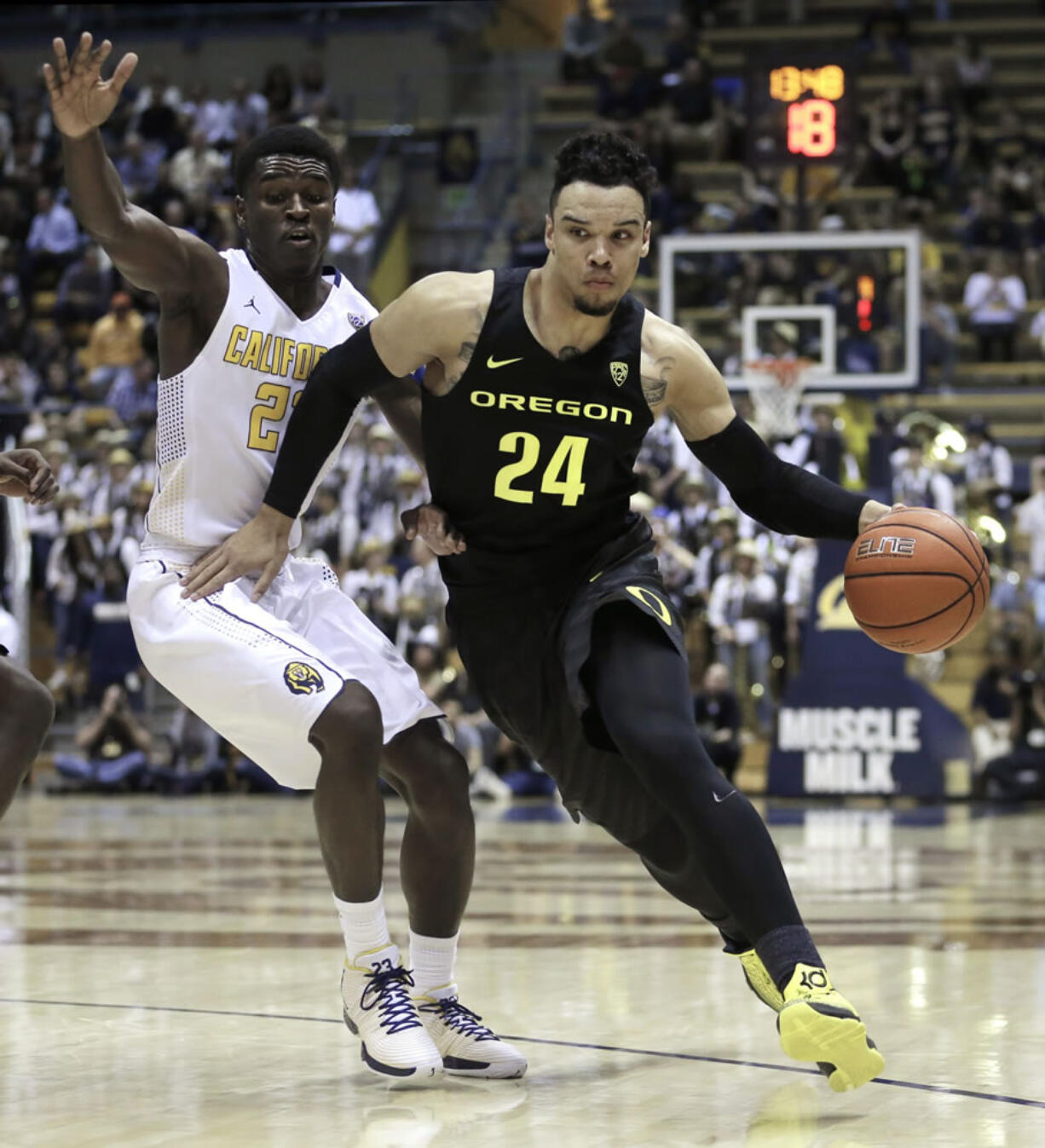 Oregon's Dillon Brooks, right, drives the ball against California's Jabari Bird in the first half of an NCAA college basketball game Thursday, Feb. 11, 2016, in Berkeley, Calif.