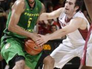 Oregon's Tyler Dorsey (5) is defended by Stanford's Christian Sanders during the first half of an NCAA college basketball game in Stanford, Calif., Saturday, Feb. 13, 2016.