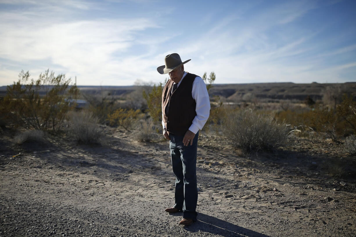 Rancher Cliven Bundy stands along the road Jan. 27 near his ranch in Bunkerville, Nev. Bundy, the father of the jailed leader of the Oregon refuge occupation who was the center of a standoff with federal officials in Nevada in 2014, was arrested Feb. 10 in Portland.