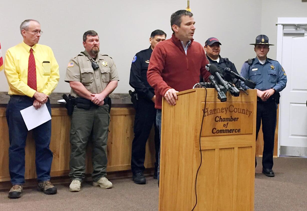 FBI Special Agent in Charge Greg Bretzing, at podium, talks to reporters at the Chamber of Commerce in Burns, Ore., on Thursday. The end of a nearly six-week-long standoff at an Oregon wildlife refuge played out live on the Internet, with tens of thousands of people listening as supporters encouraged the last armed occupiers to surrender.