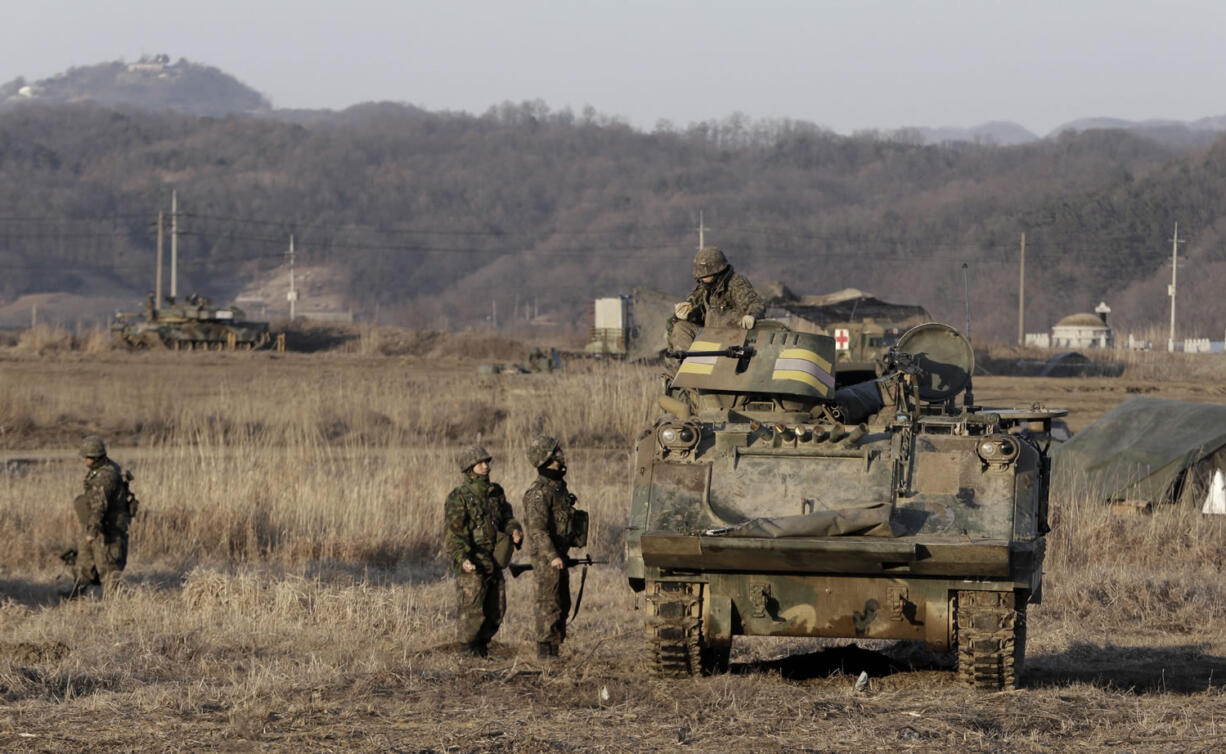 South Korean army soldiers participate in the annual exercise against possible North Korea&#039;s attack in Yeoncheon, near the border with North Korea on Wednesday. Carved in two by the Soviets and Americans at the end of WWII, the halves of the Korean Peninsula fought a vicious war in the early 1950s, and have spent much of the years since then promising, and sometimes trying very hard to engineer, each other&#039;s destruction.