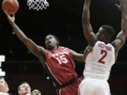 Stanford's Marcus Allen (15) shoots against Washington State's Ike Iroegbu (2) during the first half of an NCAA college basketball game Thursday, Feb. 18, 2016, in Pullman, Wash.