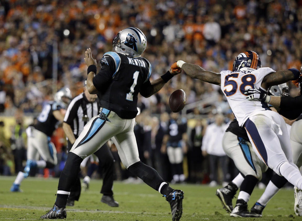 Denver Broncos Von Miller (58) strips the ball from Carolina Panthers Cam Newton (1) during the second half of the NFL Super Bowl 50 football game Sunday, Feb. 7, 2016, in Santa Clara, Calif.