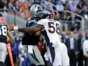 Denver Broncos’ Von Miller (58) hits Carolina Panthers’ Cam Newton, left, causing a fumble that was recovered for a touchdown during the first half of the NFL Super Bowl 50 football game Sunday, Feb. 7, 2016, in Santa Clara, Calif.