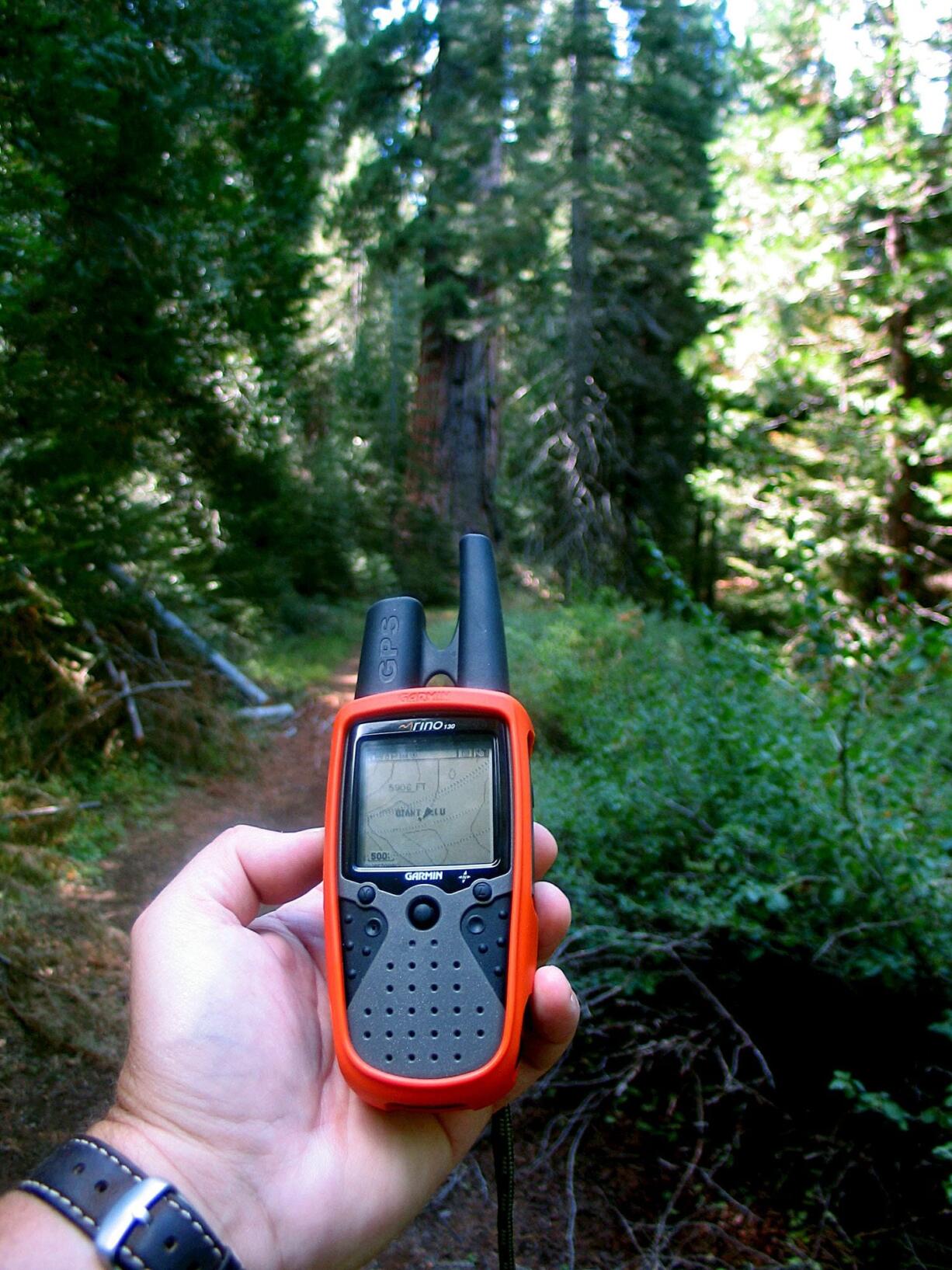 A handheld GPS unit is used at Yosemite National Park in 2005 in Yosemite, Calif. Geocaching, as it&#039;s called, has become wildly popular among owners of handheld GPS units.