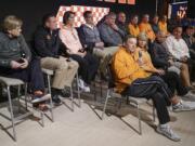 Tennessee softball coach Ralph Weekly, front row left, speaks during a news conference Tuesday in Knoxville, Tenn. The school&#039;s coaches held a news conference two weeks after a group of unidentified women sued the school over its handling of sexual assault complaints made against student-athletes. Seated to the right of Weekly is his wife and co-coach, Karen Weekly.