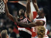 Portland’s Ed Davis (17) can block a shot or two, here against Chicago’s Bobby Portis, but he’s also known as one of the Blazers top rebounders.
