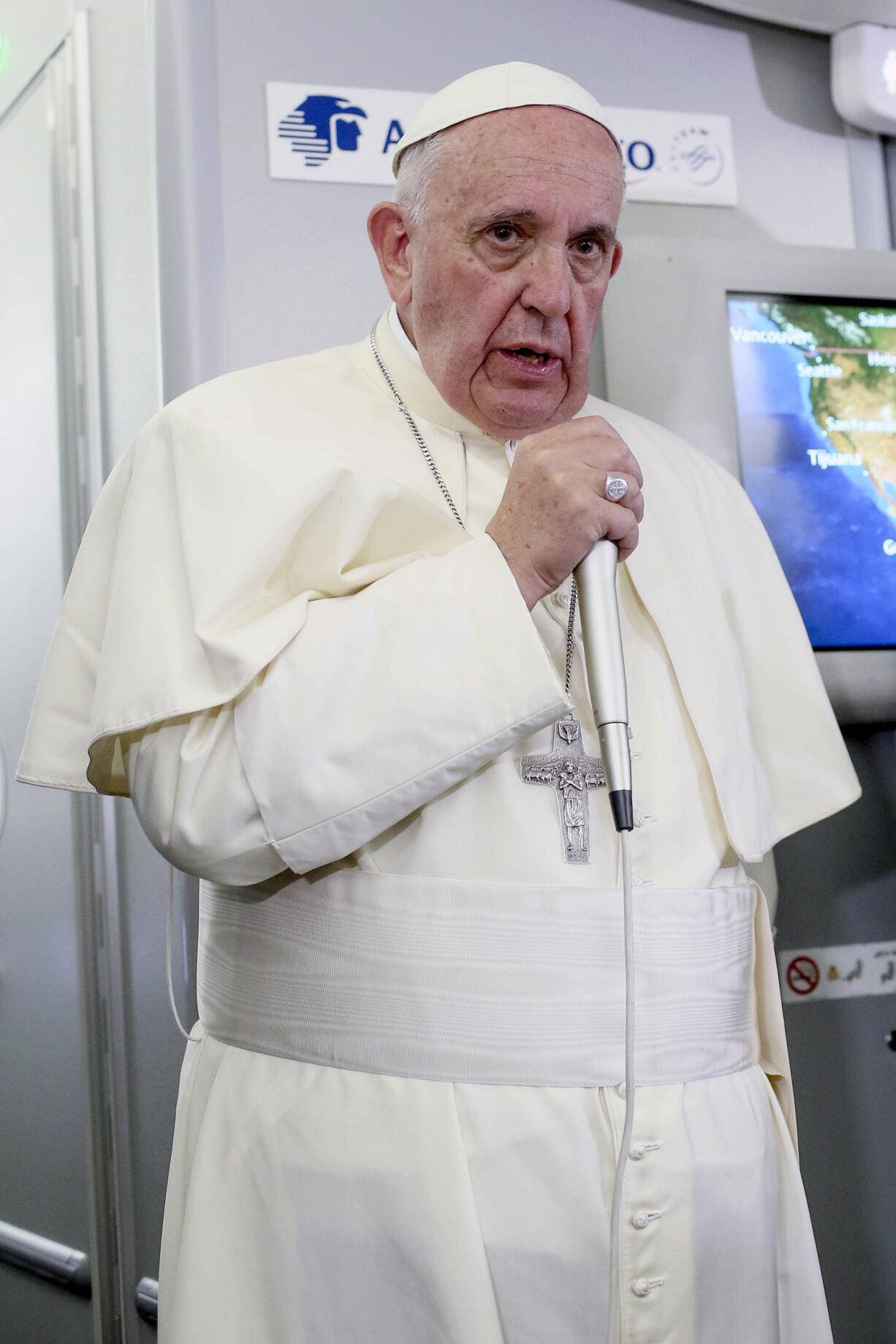 Pope Francis meets journalists Wednesday on the flight from Ciudad Juarez, Mexico, to Rome.