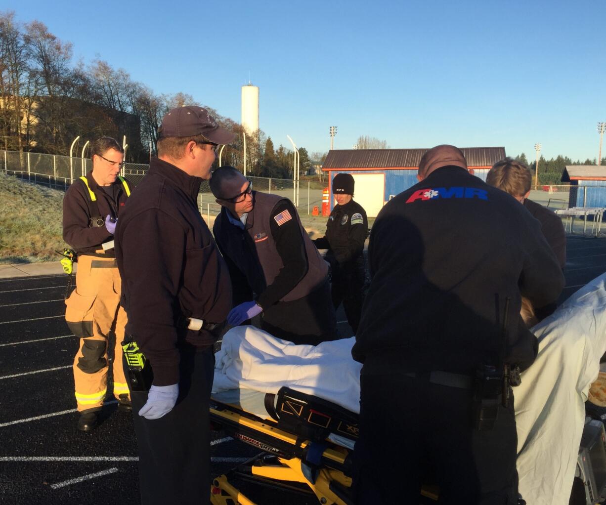 Medical personnel treated an 80-year-old Dolores Fake who was found Tuesday morning in a vehicle found in the soccer field at Ridgefield High School. Fake was reported missing Monday night.