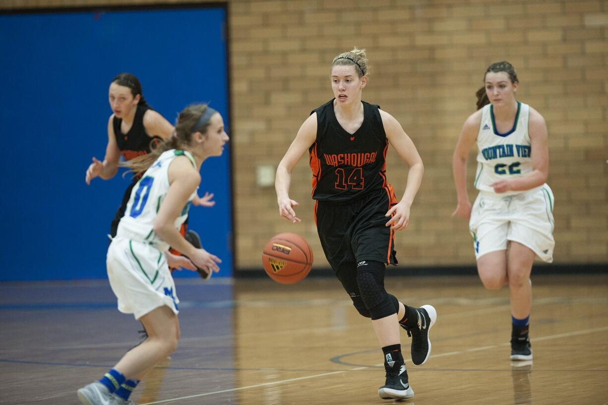 Washougal&#039;s RaeAnn Allen (14) leads a fast break against Mountain View on Thursday night, Dec. 3, 2015 at Mountain View High School.