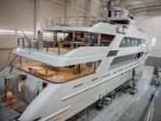 Employees of Christensen Shipyards work aboard a luxury yacht under construction Wednesday afternoon, Jan. 20, 2016 at in Southeast Vancouver.