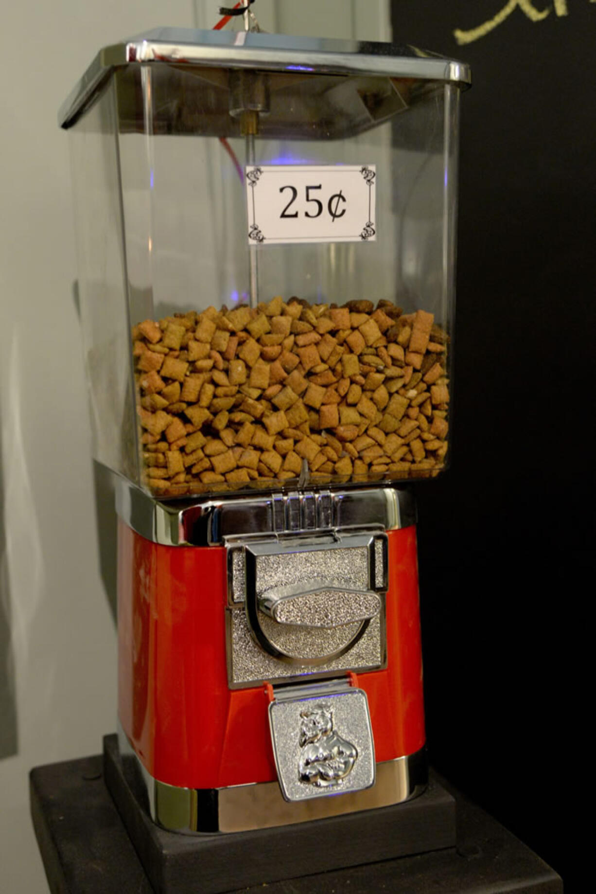 A cat food dispenser is shown during the grand opening of Le Cat Cafe in Brewerytown on March 6 in Philadelphia.